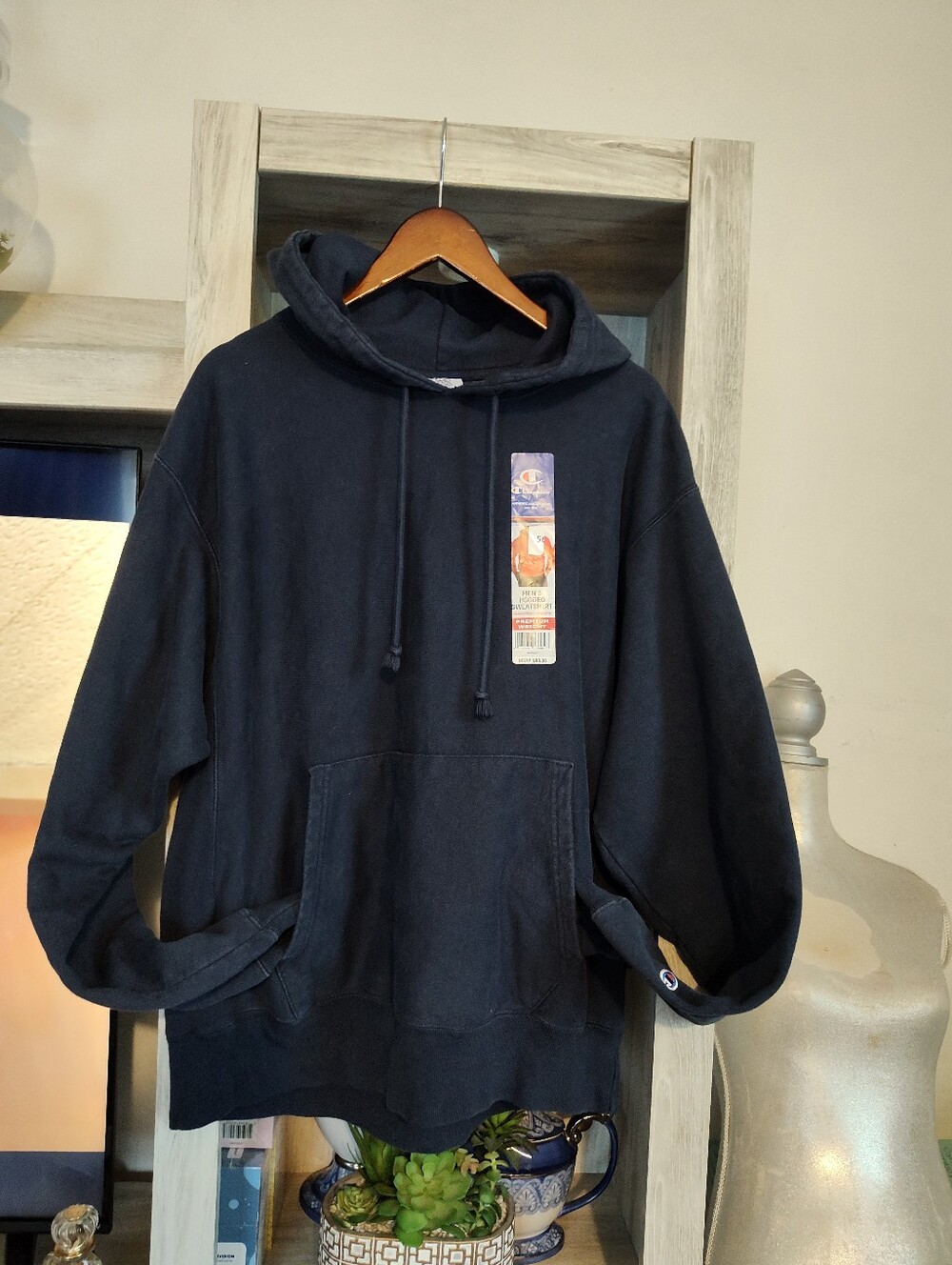 Champion navy blue fleece pullover hoodie from , featuring front pouch pocket
